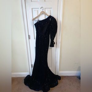 Formal sequin dress worn one time. Very thick material with zipper closure.